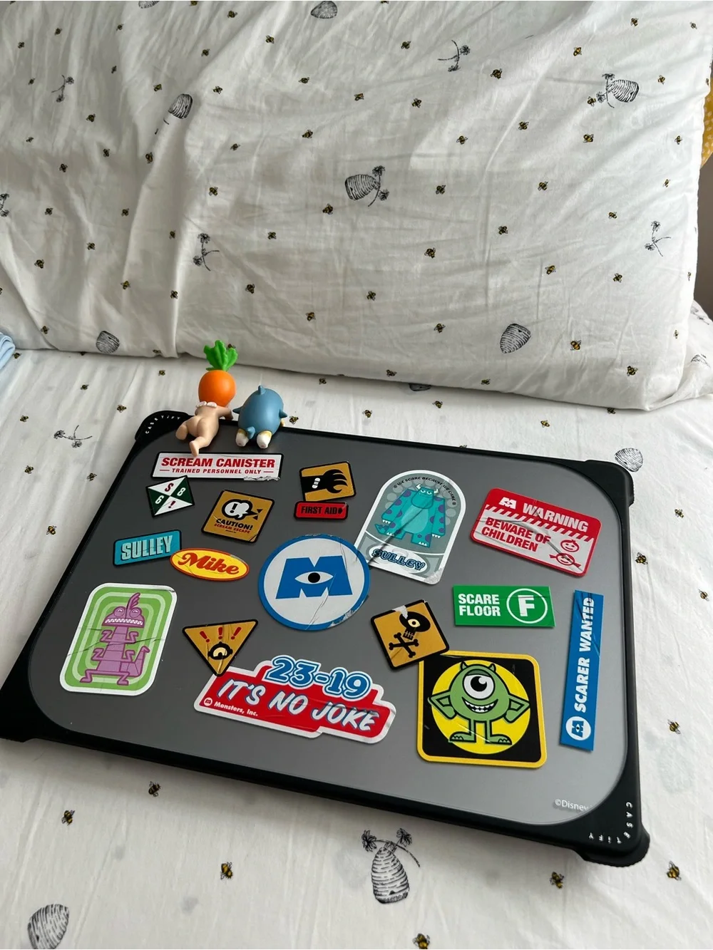 Apple Silver Laptop with Colorful Monsters University Sticker Collection
